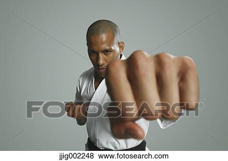 Bald male athlete in a fighting pose View Large Photo Image Stock Photo - Bald male athlete in a fighting pose. Fotosearch