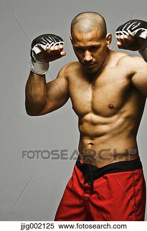 Bald male athlete in a fighting pose View Large Photo Image Stock Photography - Bald male athlete in a fighting pose. Fotosearch