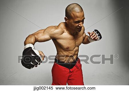 Stock Photography - Bald male athlete in a fighting pose. Fotosearch