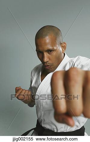 Stock Photography - Bald male athlete in a fighting pose. Fotosearch