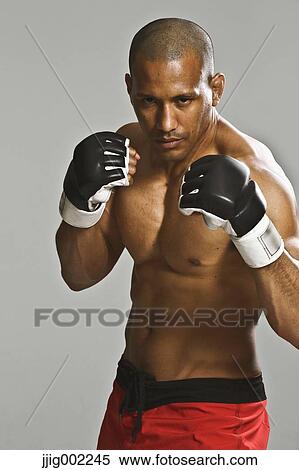 Bald male athlete in a fighting pose View Large Photo Image Stock Photography - Bald male athlete in a fighting pose. Fotosearch