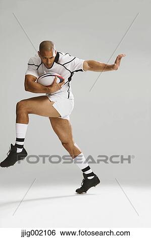 Stock Photograph - Bald male rugby player. Fotosearch
