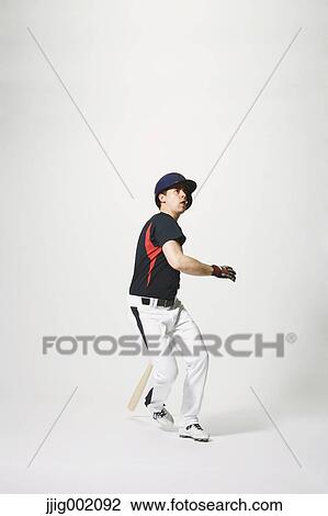 Stock Image - Baseball batter against white background. Fotosearch