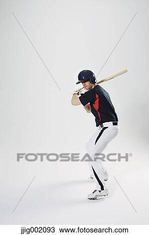 Baseball batter against white background View Large Photo Image Stock Image - Baseball batter against white background. Fotosearch