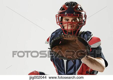 Picture - Baseball catcher against white background. Fotosearch