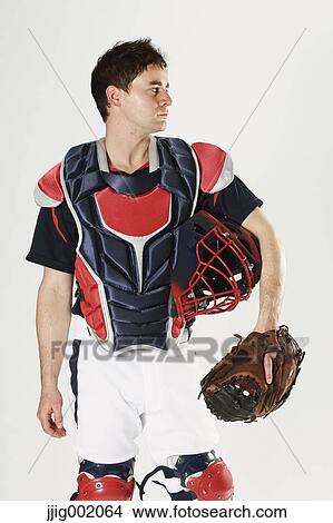 Picture - Baseball catcher against white background. Fotosearch