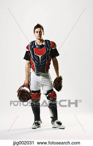 Stock Image - Baseball catcher against white background. Fotosearch