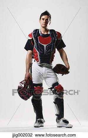 Stock Image - Baseball catcher against white background. Fotosearch