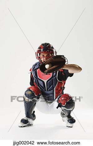 Baseball catcher against white background View Large Photo Image Stock Image - Baseball catcher against white background. Fotosearch