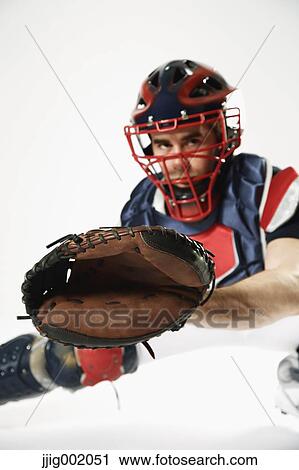 Baseball catcher against white background View Large Photo Image Stock Image - Baseball catcher against white background. Fotosearch