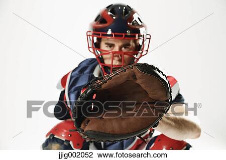 Baseball catcher against white background View Large Photo Image Stock Image - Baseball catcher against white background. Fotosearch