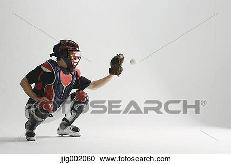 Stock Image - Baseball catcher against white background. Fotosearch