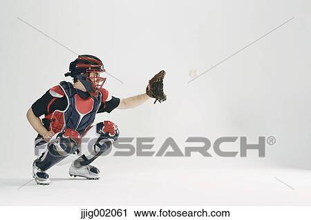 Baseball catcher against white background View Large Photo Image Stock Image - Baseball catcher against white background. Fotosearch
