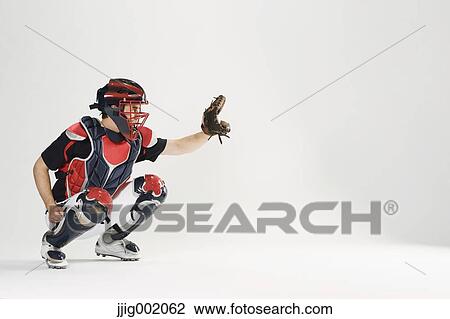Baseball catcher against white background View Large Photo Image Stock Image - Baseball catcher against white background. Fotosearch