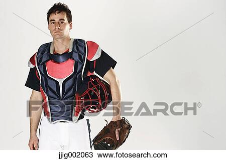 Baseball catcher against white background View Large Photo Image Stock Image - Baseball catcher against white background. Fotosearch