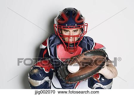 Baseball catcher against white background View Large Photo Image Stock Image - Baseball catcher against white background. Fotosearch