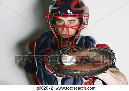 Baseball catcher against white background View Large Photo Image Stock Image - Baseball catcher against white background. Fotosearch