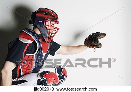 Stock Image - Baseball catcher against white background. Fotosearch