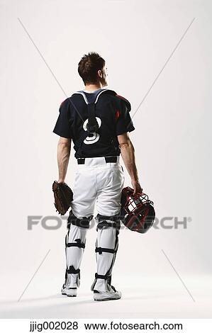 Baseball catcher against white background View Large Photo Image Stock Photo - Baseball catcher against white background. Fotosearch
