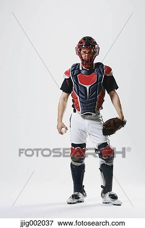 Stock Photo - Baseball catcher against white background. Fotosearch