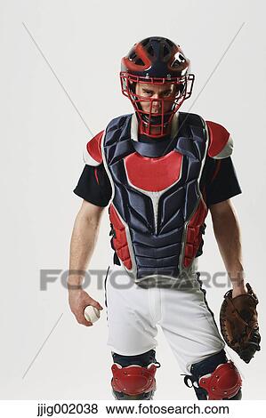 Baseball catcher against white background View Large Photo Image Stock Photo - Baseball catcher against white background. Fotosearch