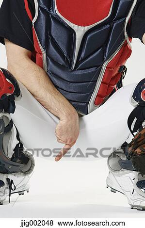 Baseball catcher against white background View Large Photo Image Stock Photo - Baseball catcher against white background. Fotosearch