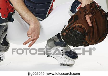 Baseball catcher against white background View Large Photo Image Stock Photo - Baseball catcher against white background. Fotosearch
