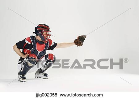 Baseball catcher against white background View Large Photo Image Stock Photo - Baseball catcher against white background. Fotosearch
