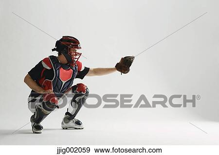Baseball catcher against white background View Large Photo Image Stock Photo - Baseball catcher against white background. Fotosearch
