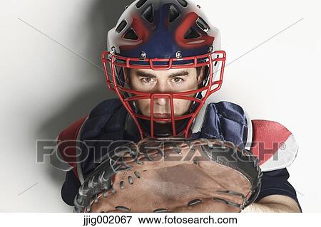 Baseball catcher against white background View Large Photo Image Stock Photo - Baseball catcher against white background. Fotosearch