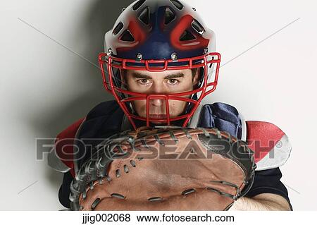 Baseball catcher against white background View Large Photo Image Stock Photo - Baseball catcher against white background. Fotosearch