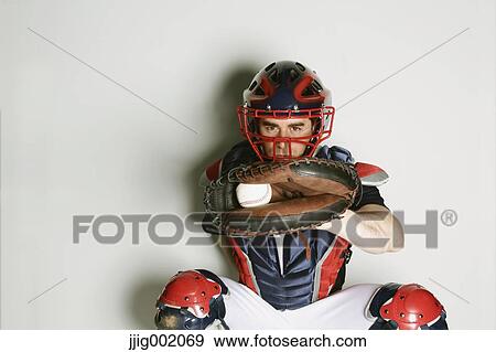 Baseball catcher against white background View Large Photo Image Stock Photo - Baseball catcher against white background. Fotosearch