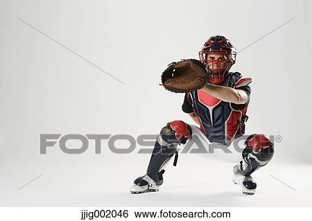 Stock Photograph - Baseball catcher against white background. Fotosearch