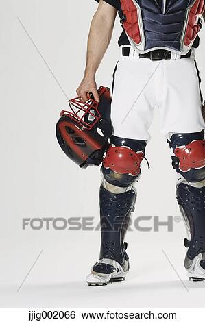 Stock Photograph - Baseball catcher against white background. Fotosearch