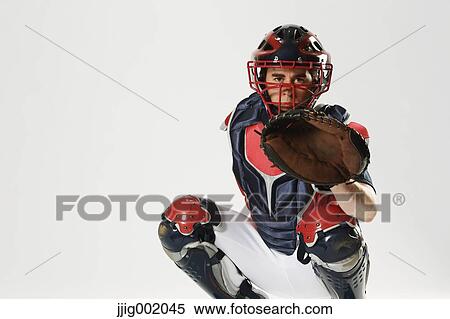 Stock Photography - Baseball catcher against white background. Fotosearch
