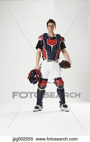 Baseball catcher against white background View Large Photo Image Stock Photography - Baseball catcher against white background. Fotosearch