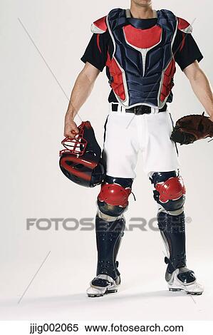 Baseball catcher against white background View Large Photo Image Stock Photography - Baseball catcher against white background. Fotosearch