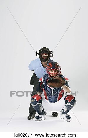 Baseball catcher and chief referee against white background View Large Photo Image Stock Photo - Baseball catcher and chief referee against white background. Fotosearch