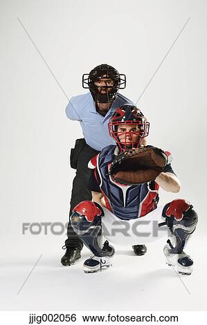 Baseball catcher and chief referee against white background View Large Photo Image Stock Photograph - Baseball catcher and chief referee against white background. Fotosearch
