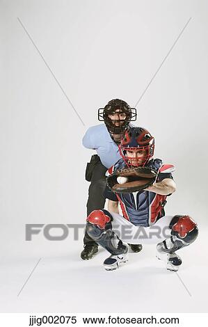 Baseball catcher and chief referee against white background View Large Photo Image Stock Photography - Baseball catcher and chief referee against white background. Fotosearch
