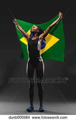 Female Athlete Holding a Brazilian Flag View Large Photo Image Picture - Female Athlete Holding a Brazilian Flag. Fotosearch