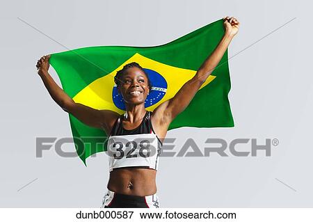 Female Athlete Holding a Brazilian Flag View Large Photo Image Stock Photo - Female Athlete Holding a Brazilian Flag. Fotosearch