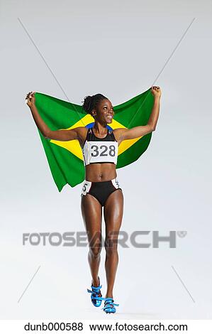 Female Athlete Holding a Brazilian Flag View Large Photo Image Stock Photo - Female Athlete Holding a Brazilian Flag. Fotosearch