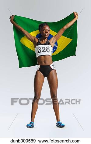 Female Athlete Holding a Brazilian Flag View Large Photo Image Stock Photo - Female Athlete Holding a Brazilian Flag. Fotosearch