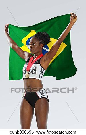 Female Athlete Holding a Brazilian Flag View Large Photo Image Stock Photography - Female Athlete Holding a Brazilian Flag. Fotosearch
