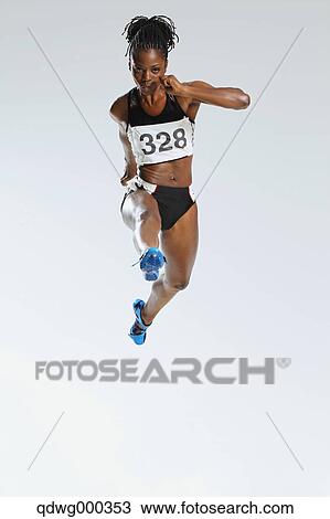 Female Athlete Running, Studio Shot View Large Photo Image Stock Image - Female Athlete Running, Studio Shot . Fotosearch