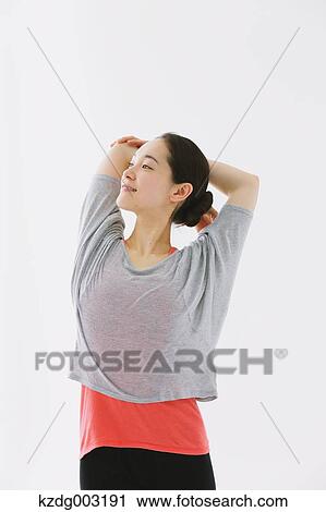 Stock Image - Japanese woman training. Fotosearch