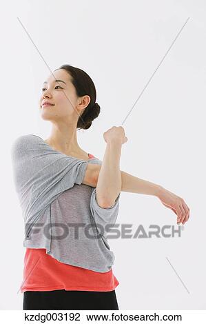 Stock Image - Japanese woman training. Fotosearch