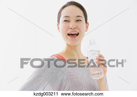 Stock Image - Japanese woman training. Fotosearch