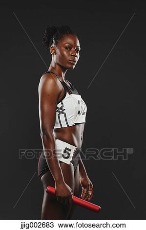 Portrait of African Female Athlete Holding Relay Baton View Large Photo Image Stock Image - Portrait of African Female Athlete Holding Relay Baton. Fotosearch